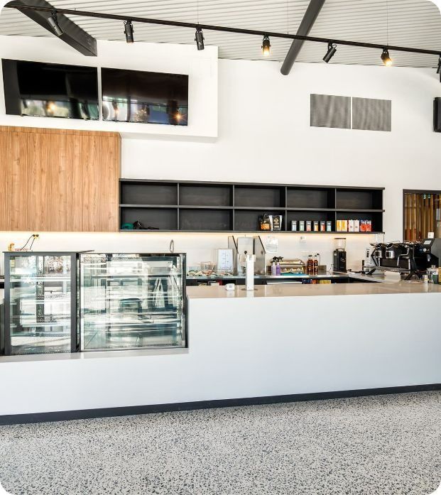 A Restaurant With a Counter and a Display Case — Moltus Construction in Braddon,  ACT