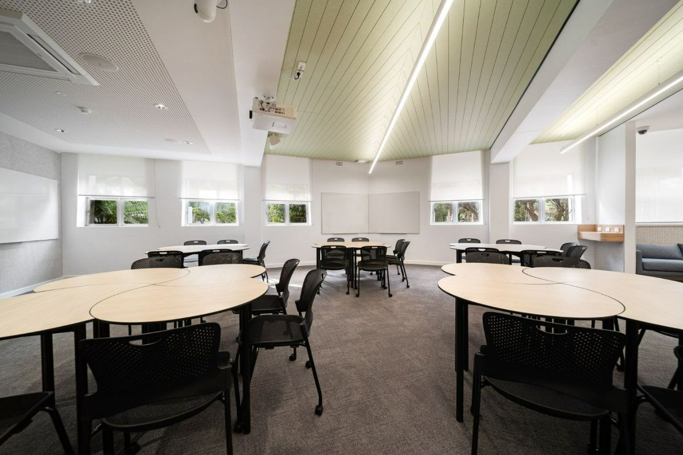 A Large Room With Tables and Chairs in It — Moltus Construction in Braddon,  ACT