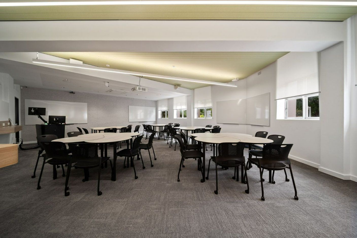 A Large Room With Tables And Chairs In It  — Moltus Construction in Braddon, ACT
