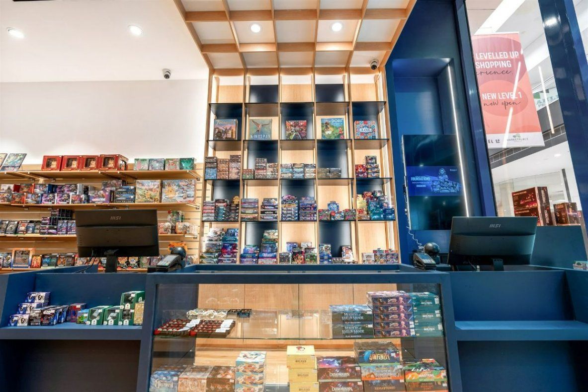 A Store Filled With Lots of Shelves and a Counter — Moltus Construction in Braddon,  ACT