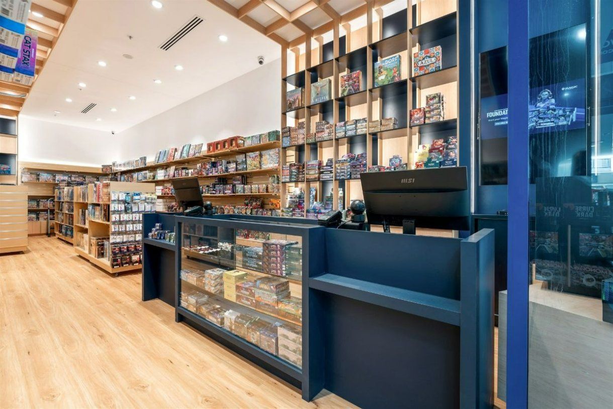 A Book Store With a Counter and Shelves Filled With Books — Moltus Construction in Braddon,  ACT