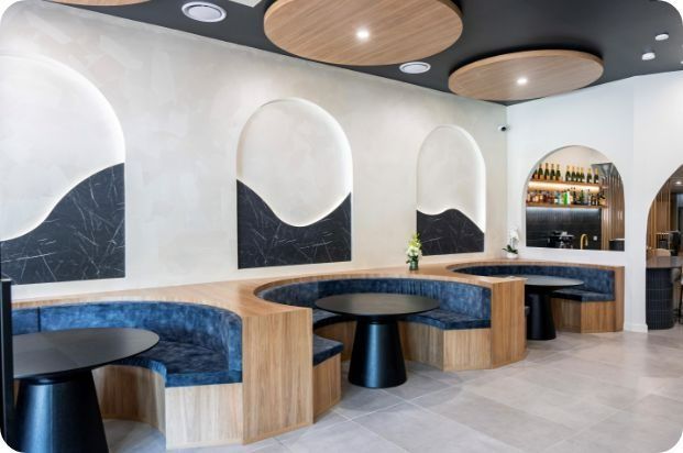 A Restaurant With Tables and Benches in It — Moltus Construction in Braddon,  ACT