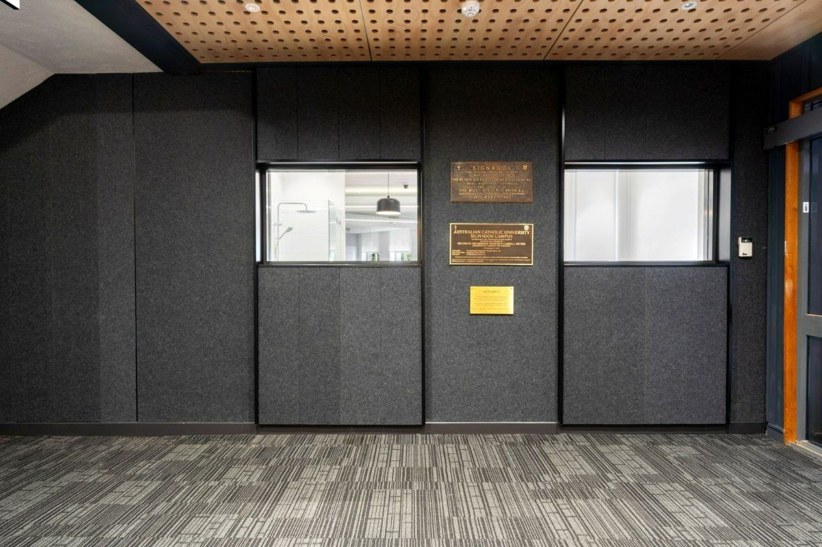 A Room With a Carpeted Floor and a Wall With a Window — Moltus Construction in Braddon,  ACT
