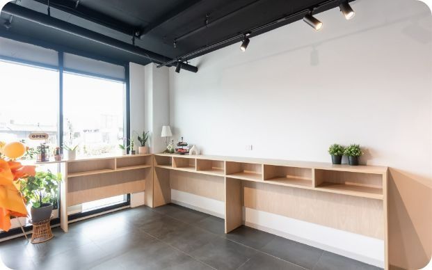 A Room With Two Desks and a Large Window — Moltus Construction in Braddon,  ACT