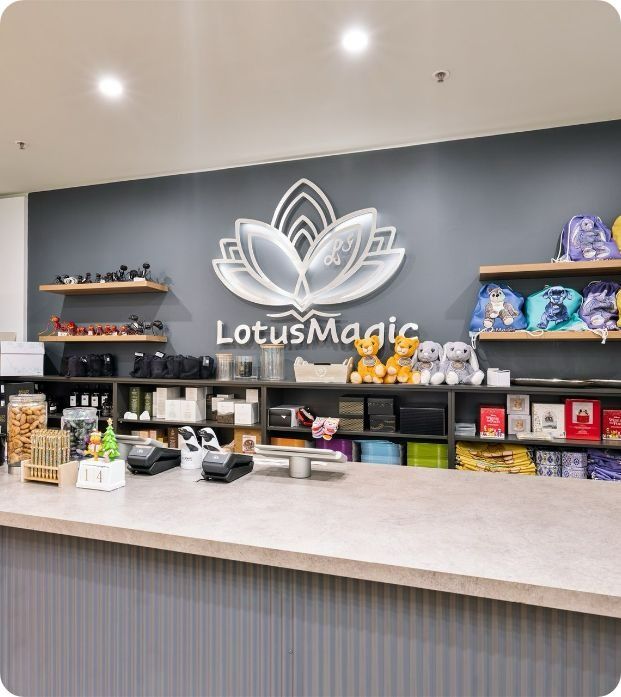 A Store Front With A Lotus Magic Logo On The Wall  — Moltus Construction in Braddon, ACT
