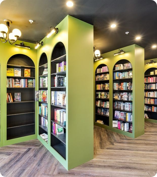 A Book Store With Lots of Books on Shelves — Moltus Construction in Braddon,  ACT