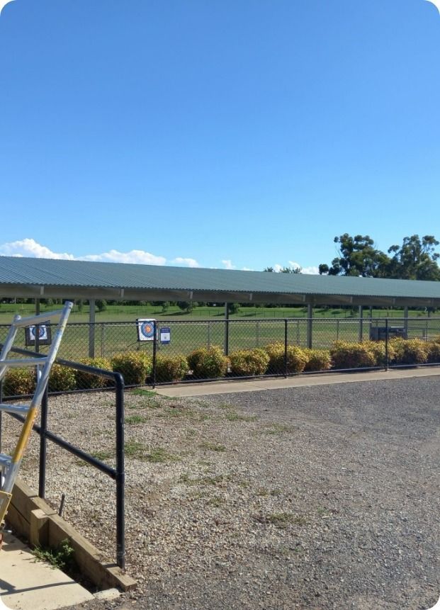 A Fenced in Area With a Staircase Leading Up to It — Moltus Construction in Braddon,  ACT
