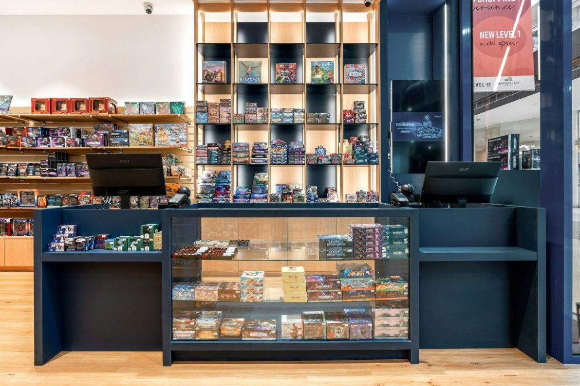 A Store Filled With Lots of Shelves and a Counter — Moltus Construction in Braddon,  ACT