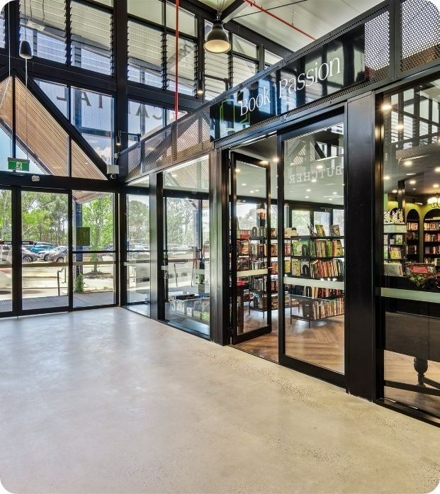 A Large Room With a Lot of Windows and Doors — Moltus Construction in Braddon,  ACT