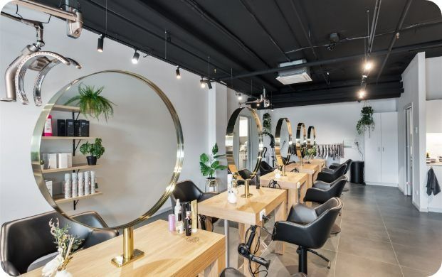 A Hair Salon With A Lot Of Chairs And Tables — Moltus Construction in Braddon, ACT