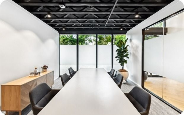 A Conference Room With a Long Table and Chairs — Moltus Construction in Braddon,  ACT