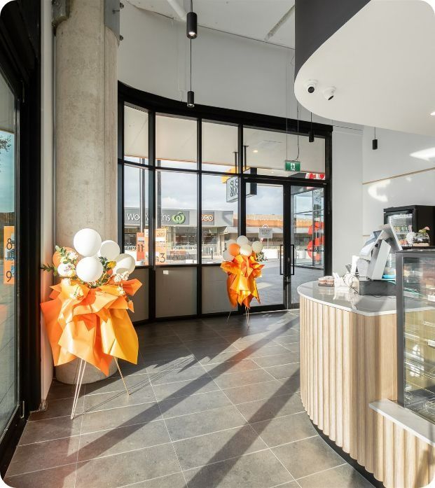 A Restaurant With a Large Window and a Counter — Moltus Construction in Braddon,  ACT