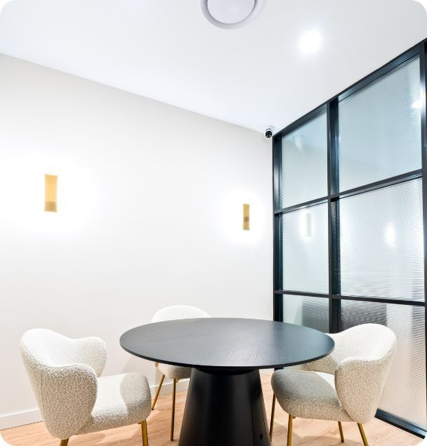 A Room With a Round Table and Chairs in It — Moltus Construction in Braddon,  ACT