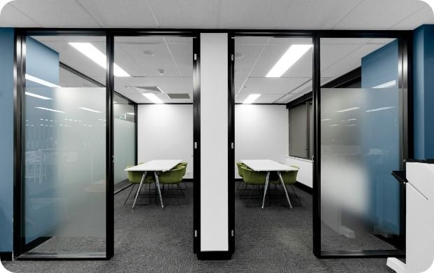 A Conference Room With a Table and Chairs in It — Moltus Construction in Braddon,  ACT