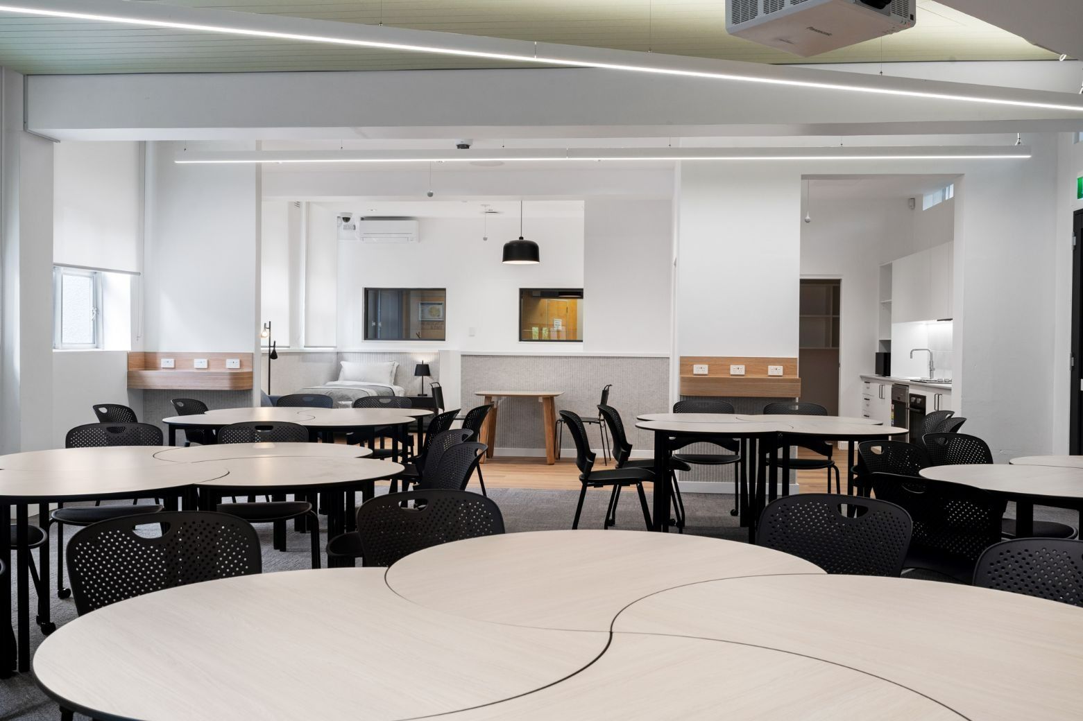 There Are a Lot of Tables and Chairs in This Room — Moltus Construction in Braddon,  ACT