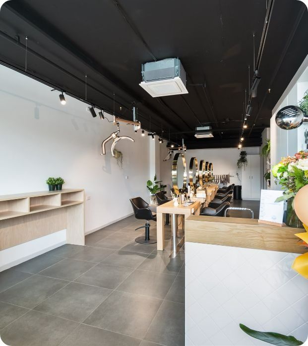 A Large Room With a Table and Chairs in It — Moltus Construction in Braddon,  ACT