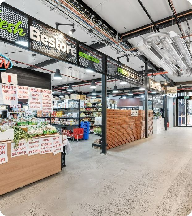 A Grocery Store With A Sign That Says Fresh Bestore — Moltus Construction in Braddon, ACT