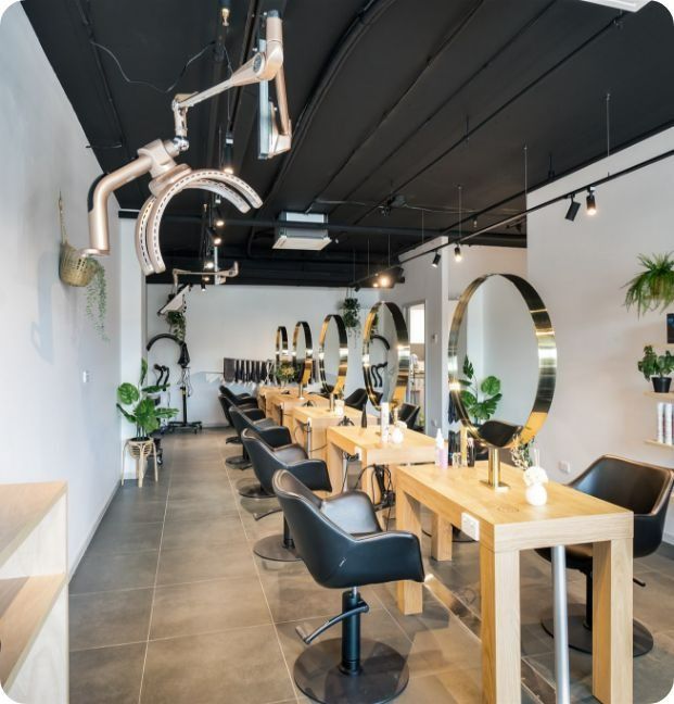A Hair Salon With A Lot Of Chairs And Tables — Moltus Construction in Braddon, ACT
