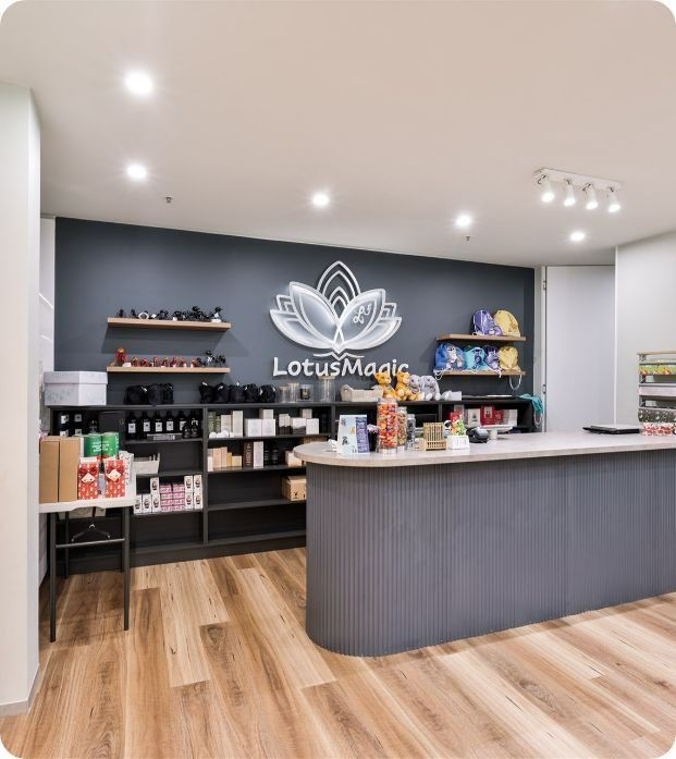 A Store With A Lotus Magic Logo On The Wall — Moltus Construction in Braddon, ACT