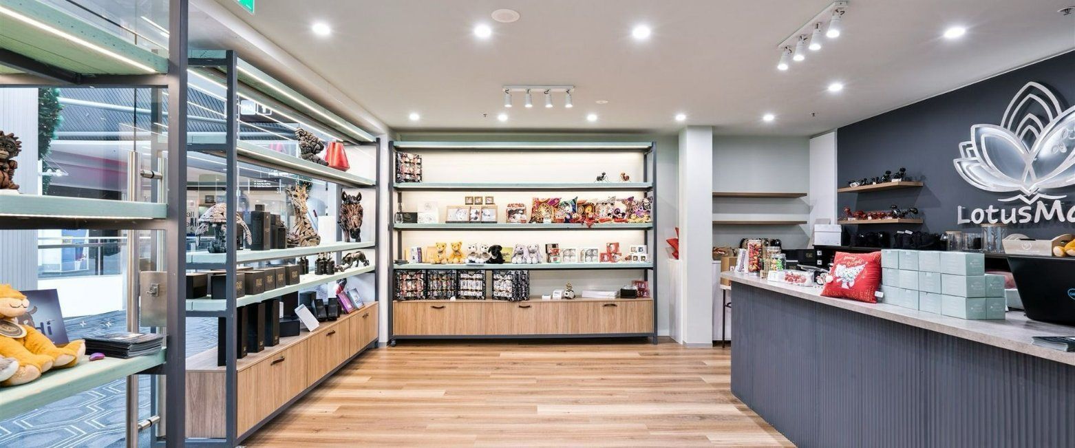 A Store With Lots of Shelves and a Counter — Moltus Construction in Braddon,  ACT