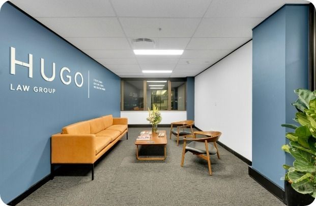 A Hugo Law Group Lobby With a Couch and Chairs — Moltus Construction in Braddon,  ACT