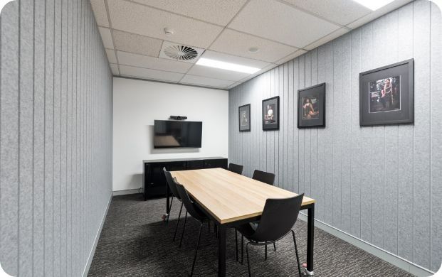 A Conference Room With a Long Table and Chairs — Moltus Construction in Braddon,  ACT