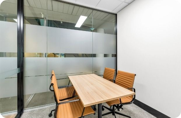 A Conference Room With a Table and Chairs in It — Moltus Construction in Braddon,  ACT
