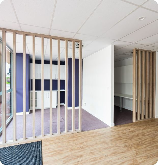 A Room With a Wooden Divider Between Two Rooms — Moltus Construction in Braddon,  ACT