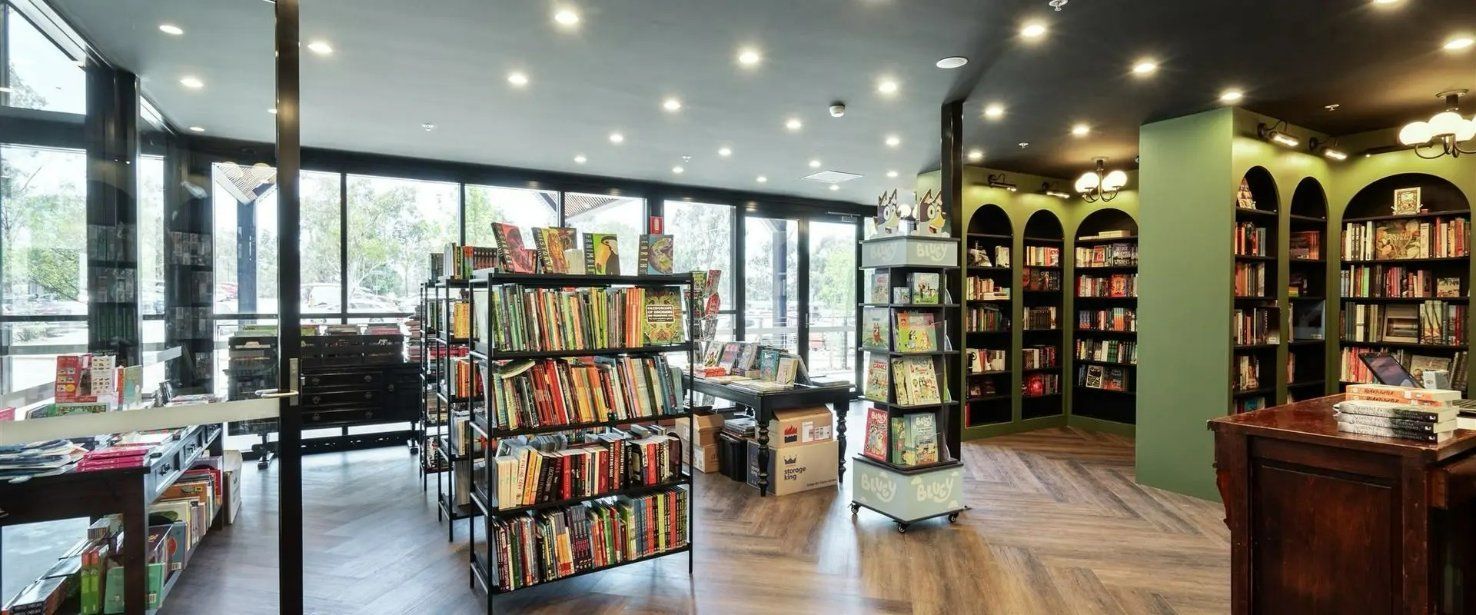 A Bookstore With Lots of Books on Shelves and a Counter — Moltus Construction in Braddon,  ACT