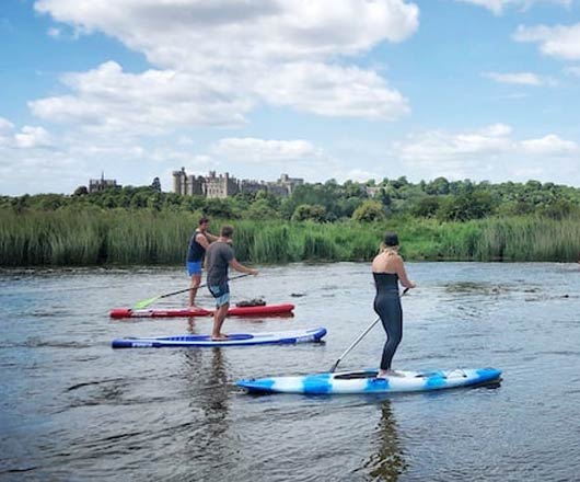 Paddle boards on the river arun