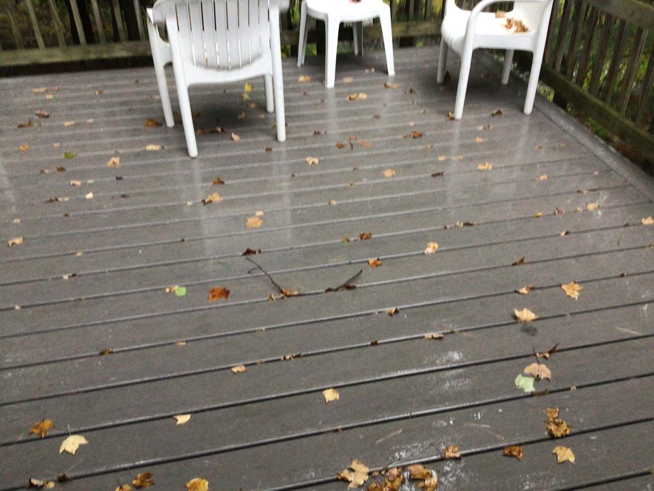 A deck with a table and chairs on it