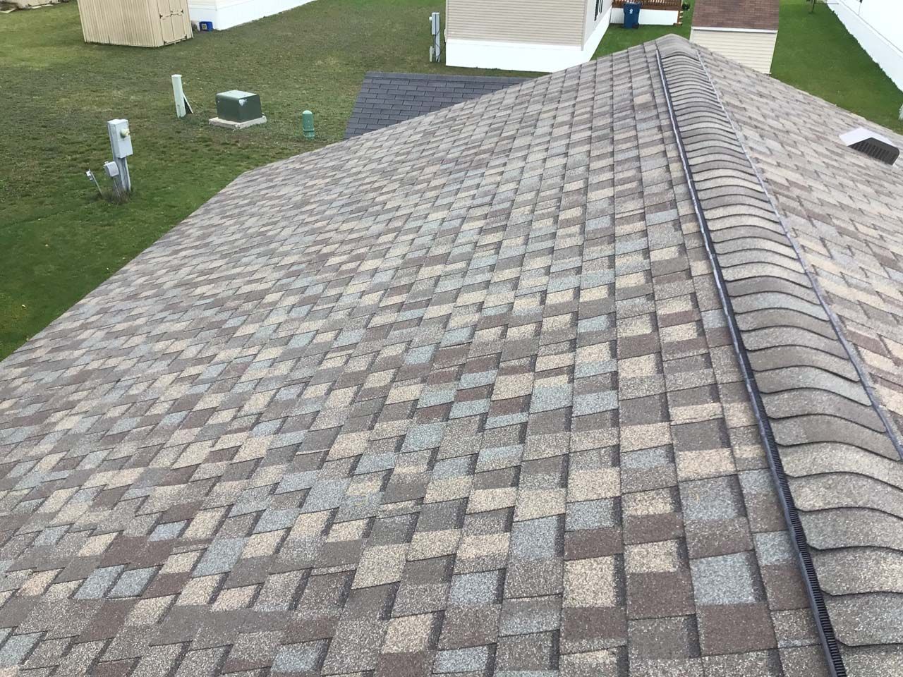 A close up of a roof with shingles on it.