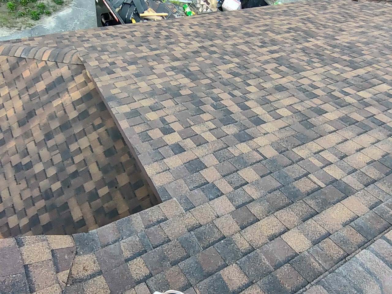 A close up of a roof with a lot of shingles on it.