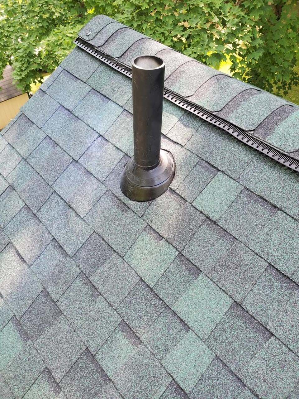 A roof with a chimney on top of it.