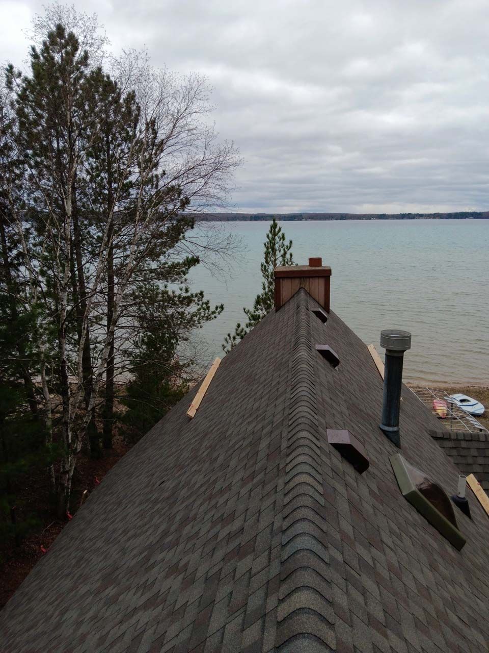 The roof of a house overlooking a body of water