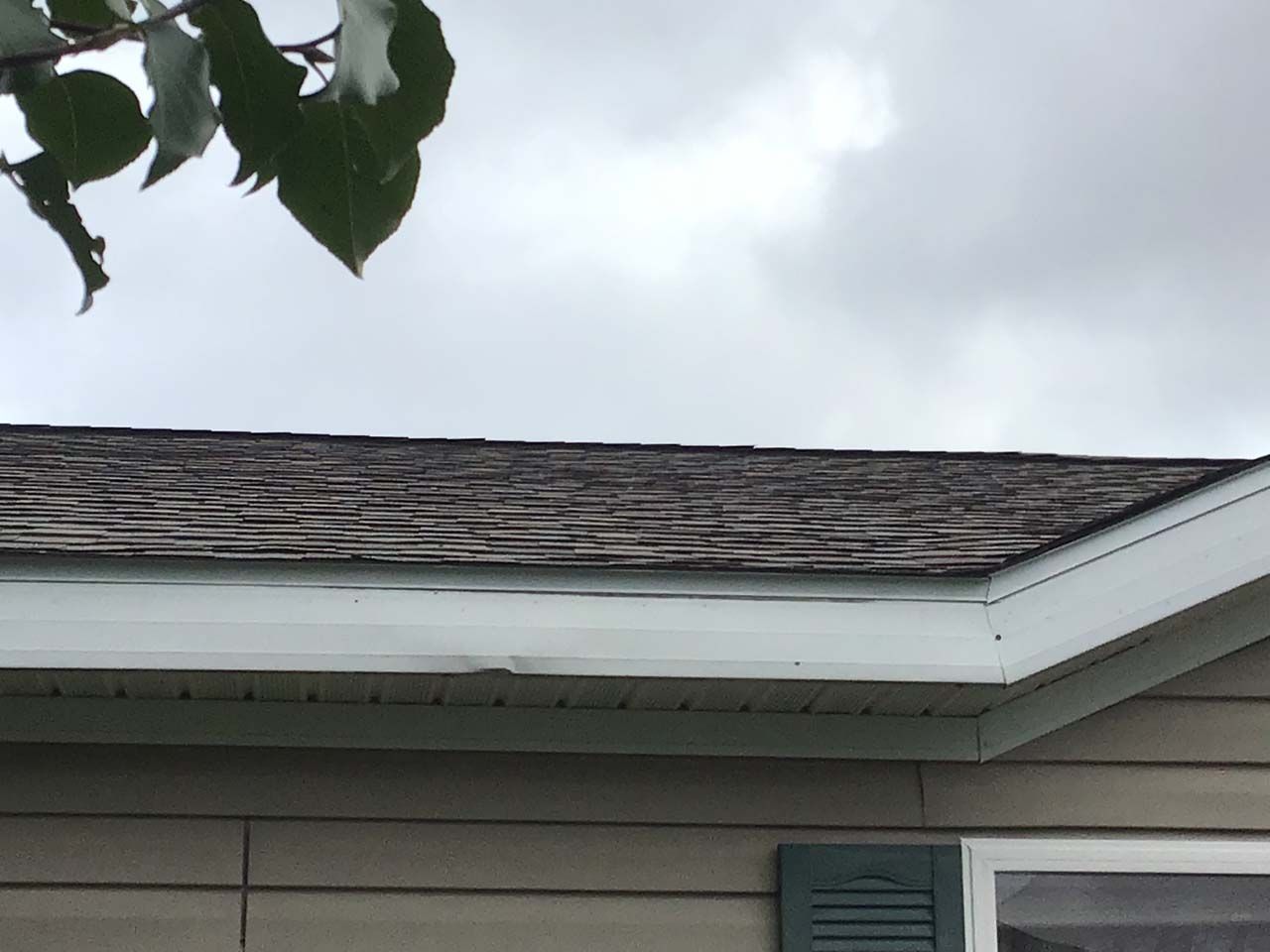 A house with a roof that has shingles on it