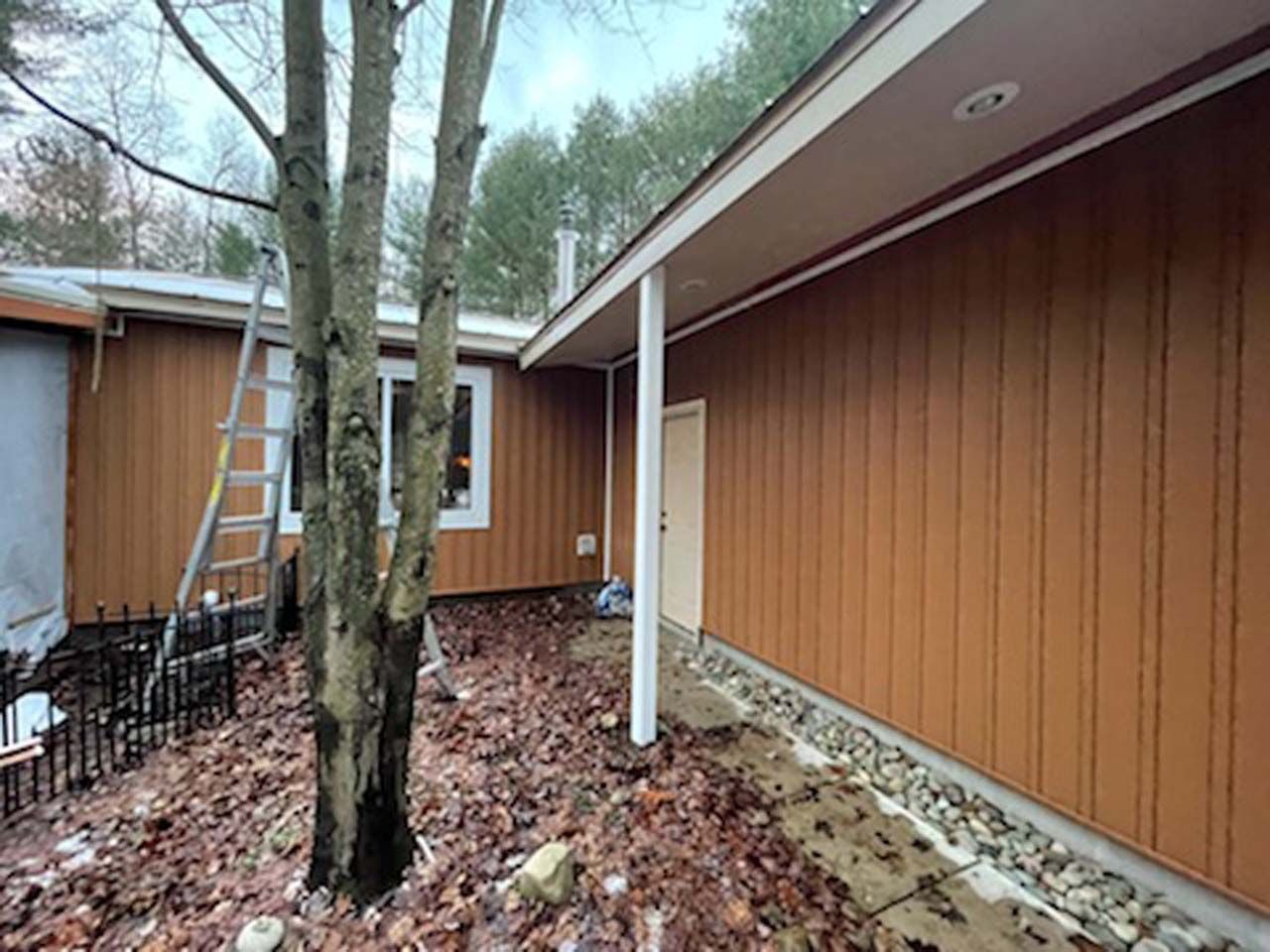 A house with a ladder on the side of it