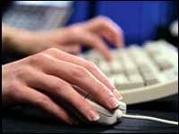 hand on mouse and keyboard