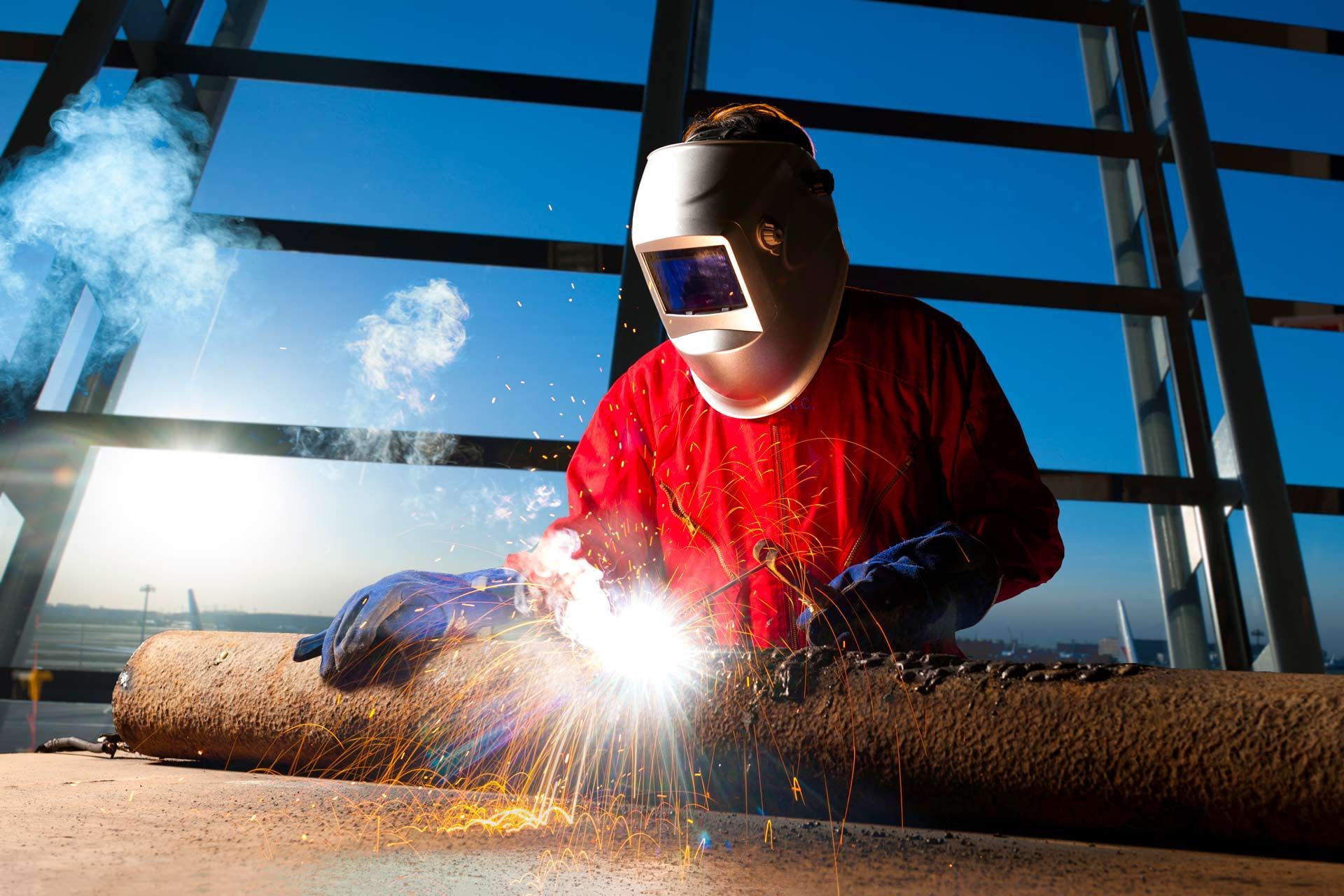 Industrial Welder Working a Welding Metal with Protective Mask and Sparks on Piping Work | Townsville, Qld