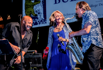 Ginny Bales and band performing on stage in CT