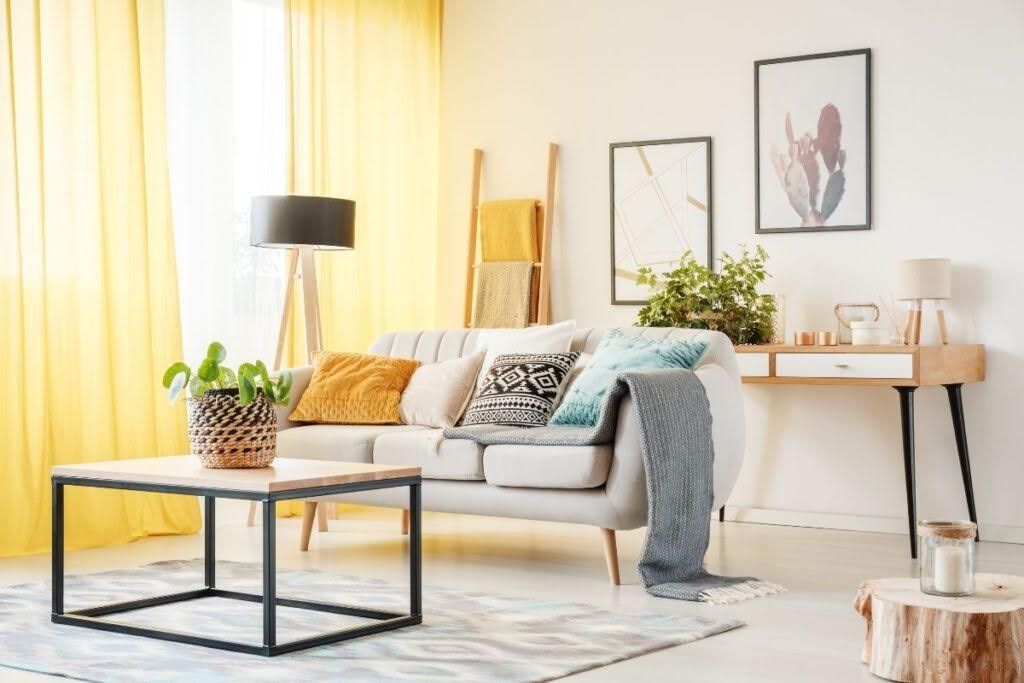 Clean and organized living room after spring decluttering with bright decor and minimal clutter.