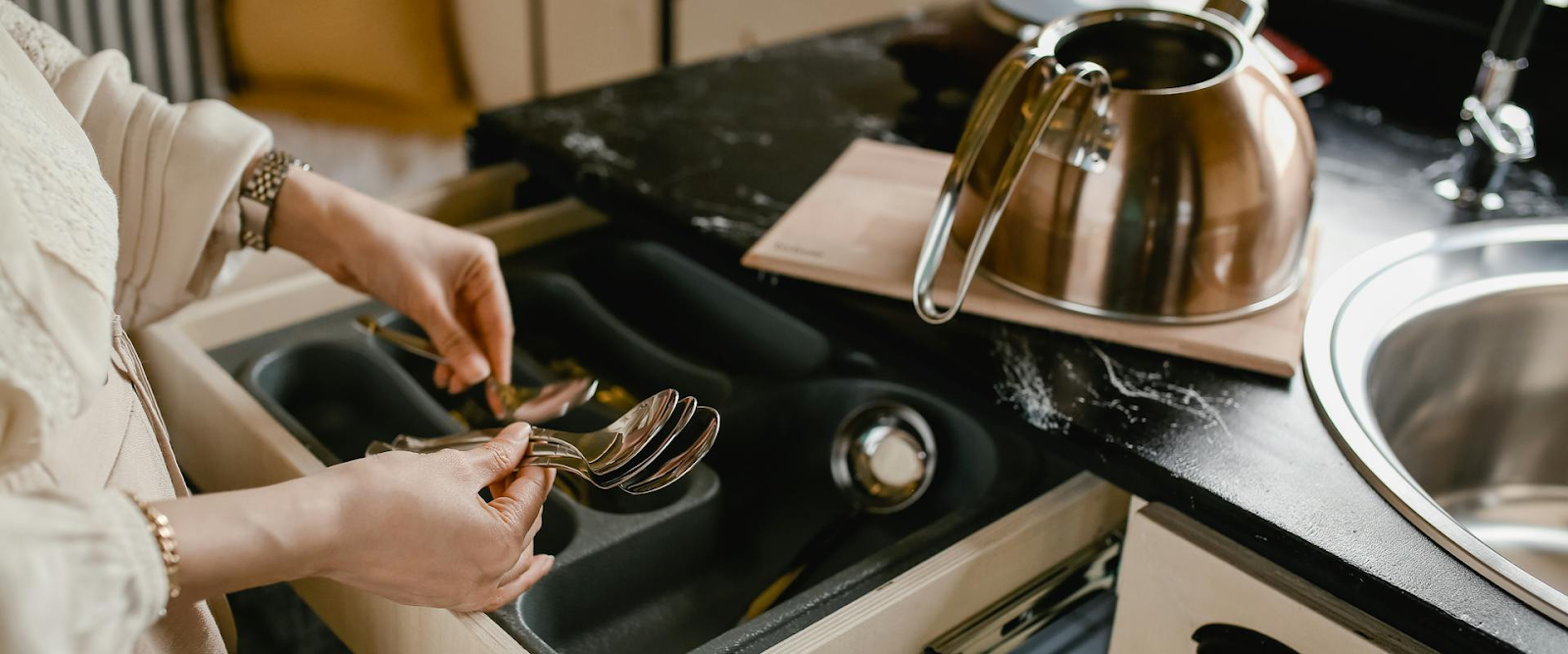 Kitchen drawer arranged by decluttering experts.