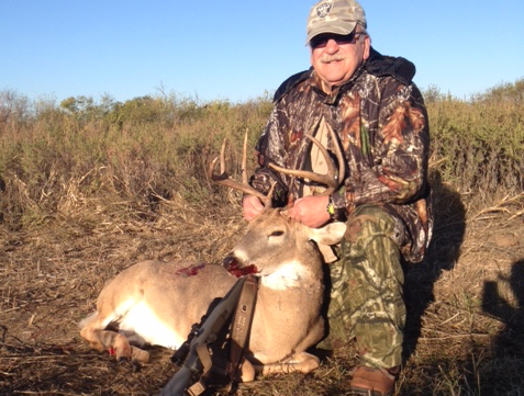 Earl W. with the deer he harvested on a Salt Fork Hunt