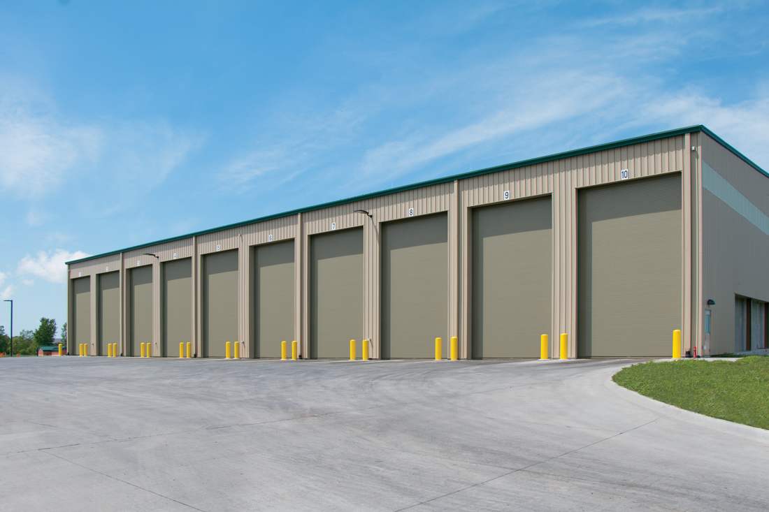 A large building with a lot of garage doors on it