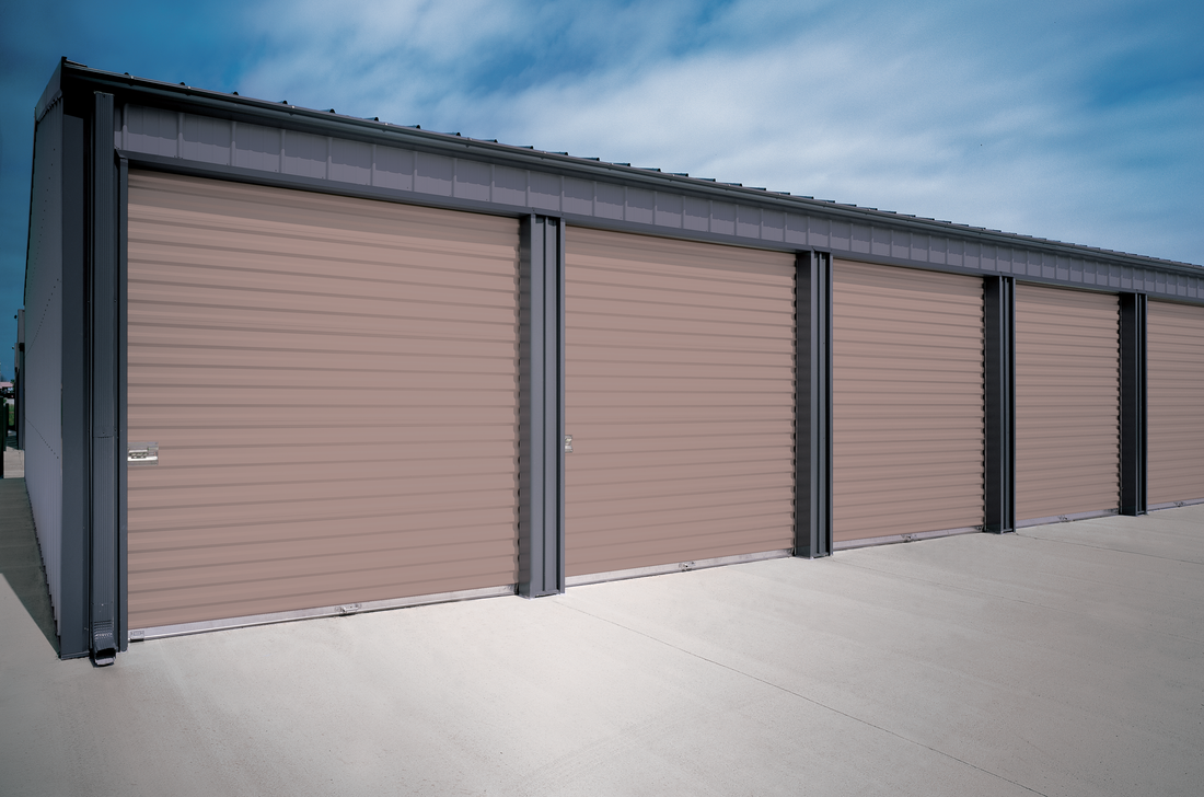 A row of garage doors with a blue sky in the background.