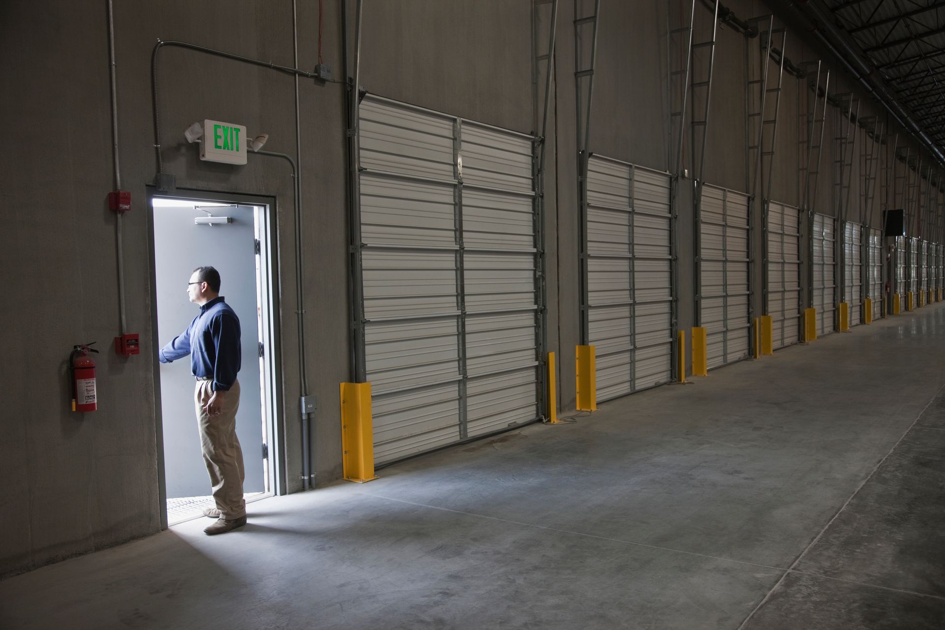 A large white house with black trim and a black roof.
