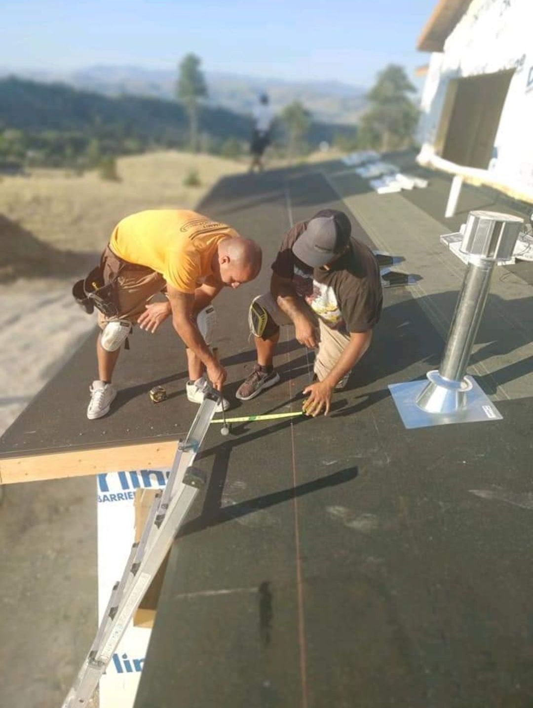 Ellingson Roofing LLC - 2 Roofers measuring and snapping lines
