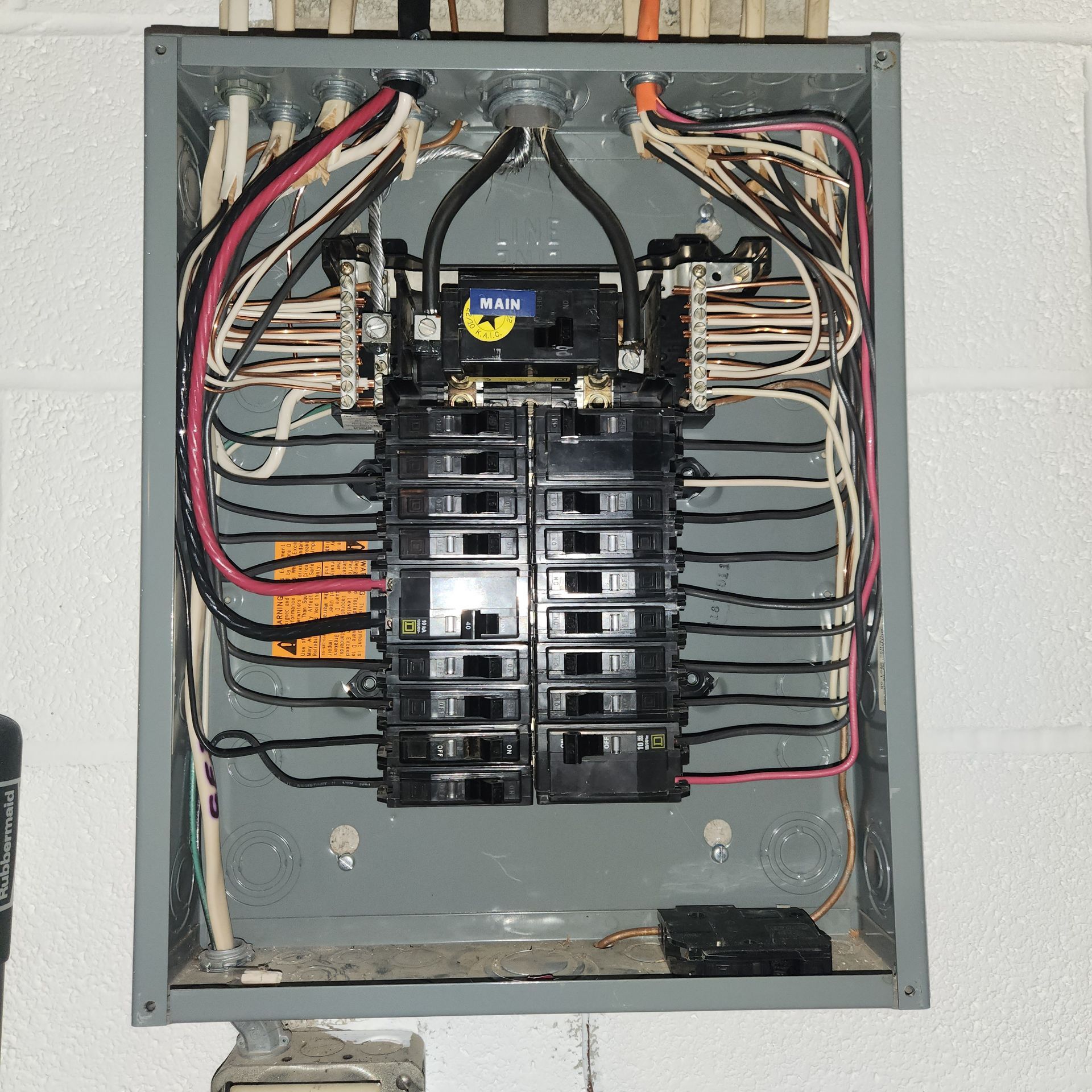 A large electrical box with a lot of wires coming out of it