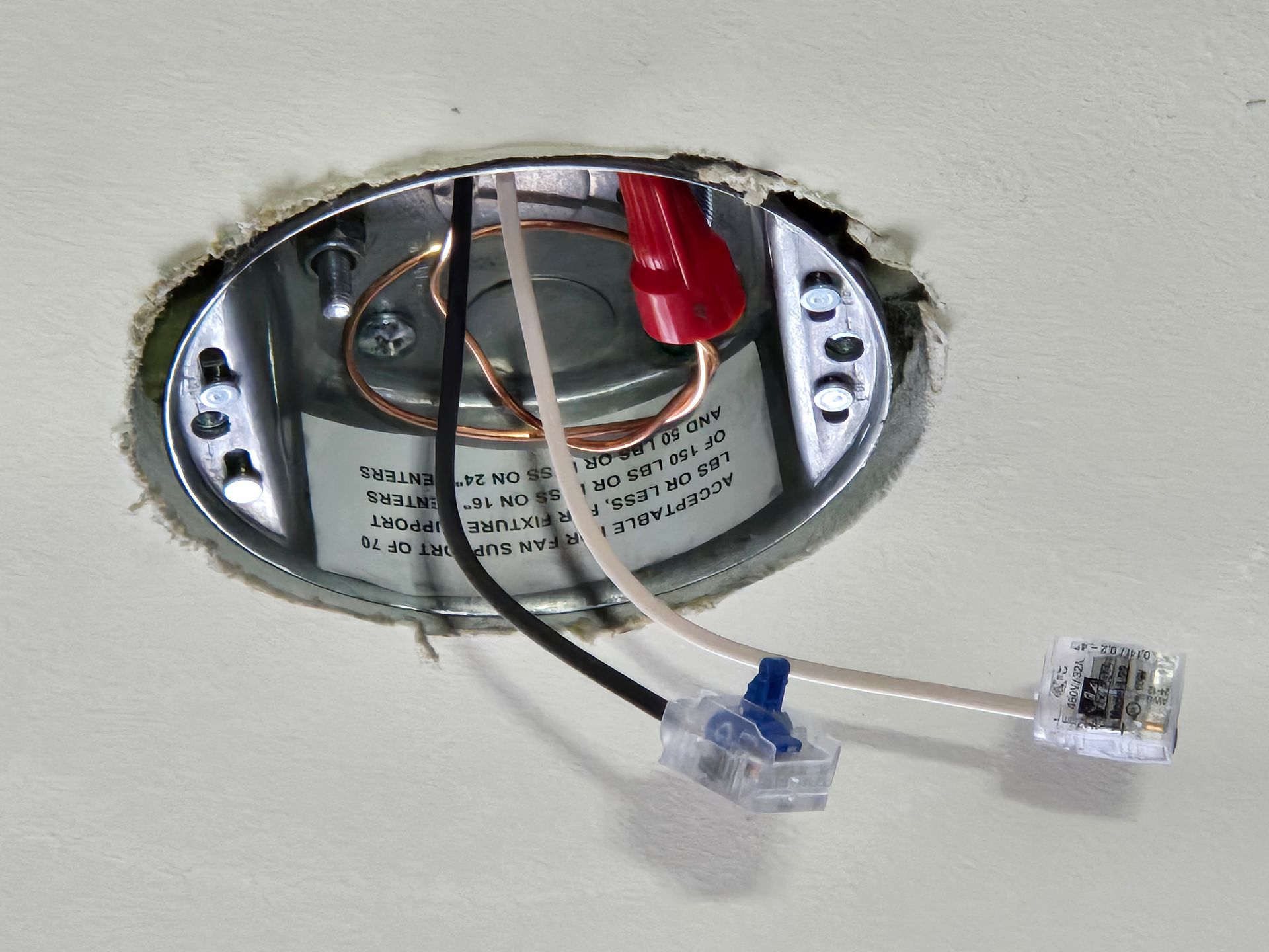 A metal box with wires coming out of it