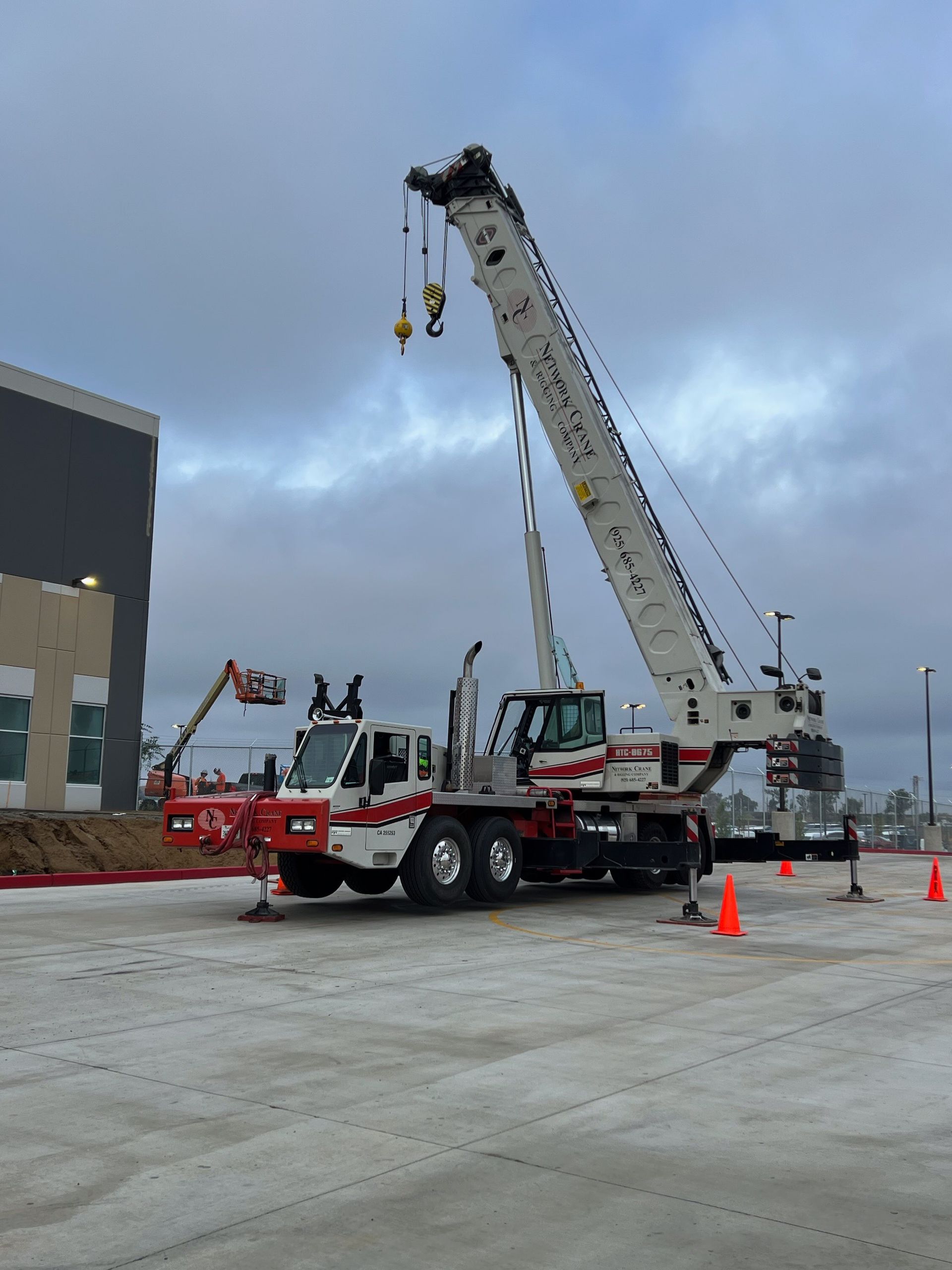 A white and red truck with the letters ic on the side